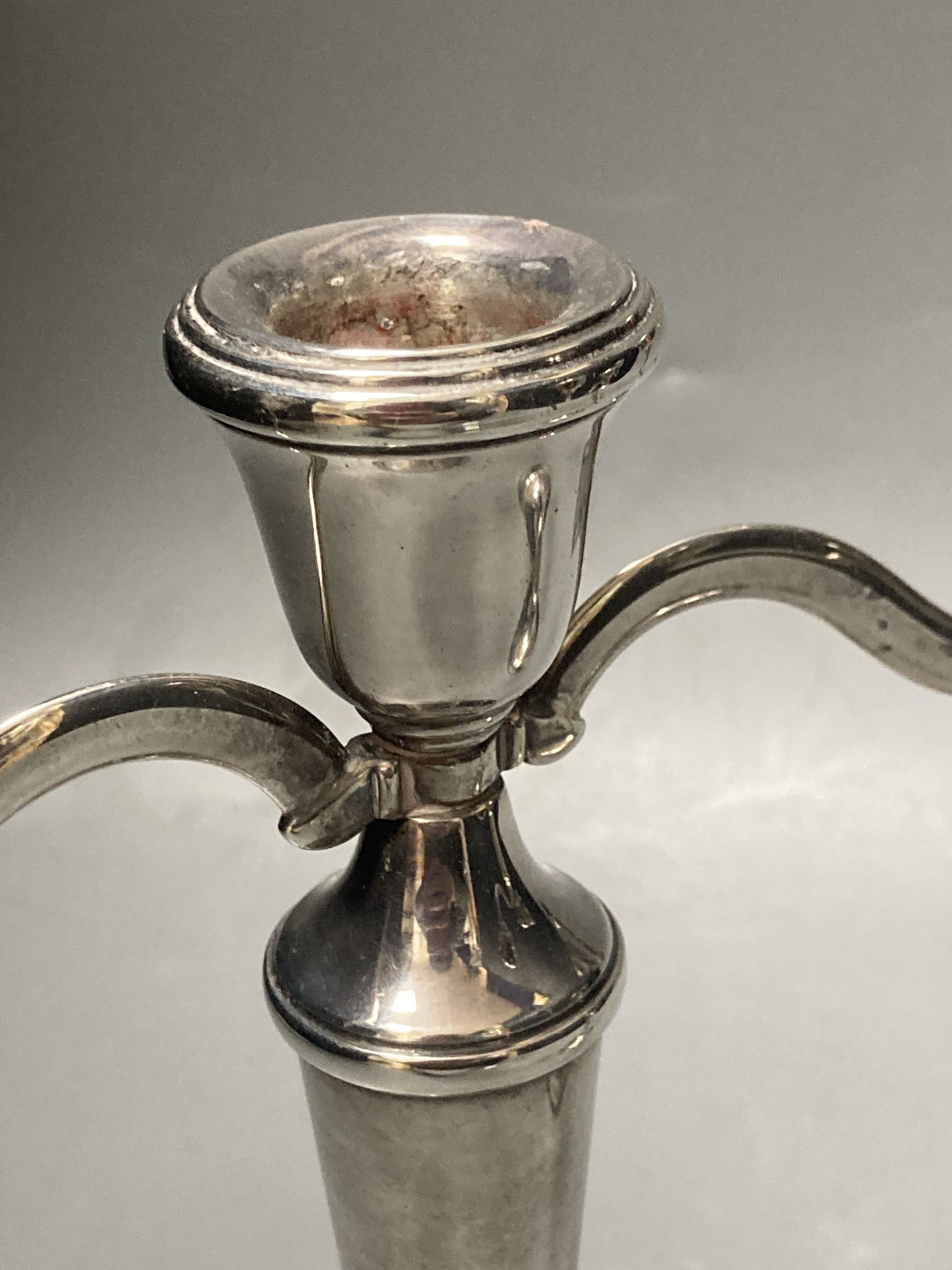 A modern pair of silver two branch, three light candelabra, Birmingham, 1988, 21.1cm, weighted.